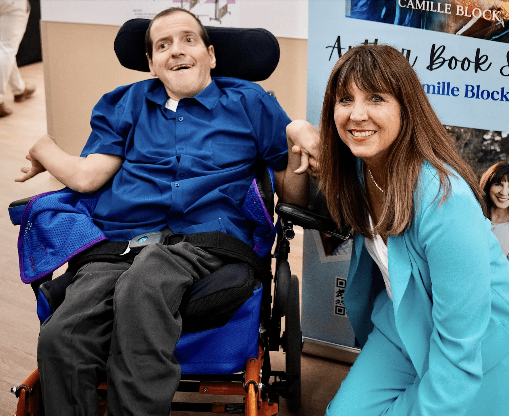 woman experiencing secondhand suffering holding hand of disabled brother with cerebral palsy while both are smiling a camera